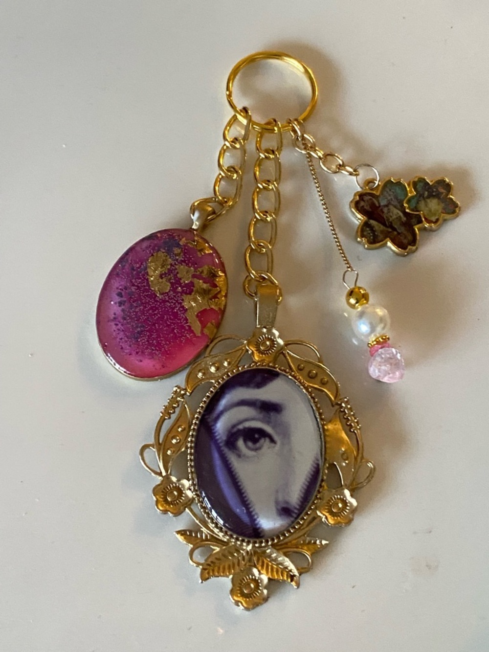 BAG CHARM KEYCHAIN PURSE ACCESSORIE FORNASETTI EVIL EYE PINK PURPLE FLORAL GOLD - Picture 2 of 6